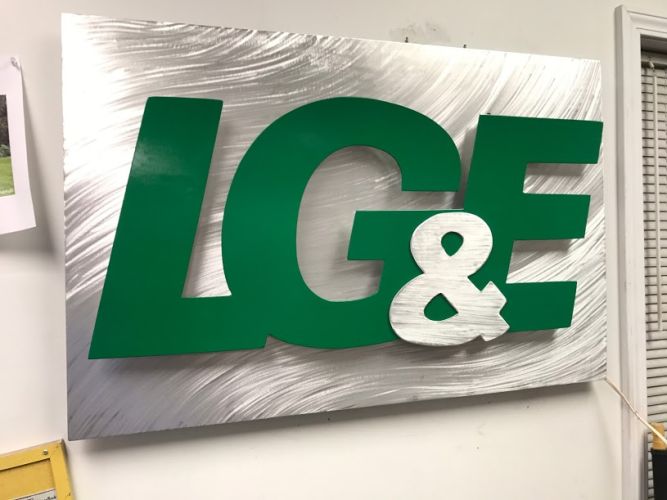 led business sign in brushed aluminum and green LED lighting